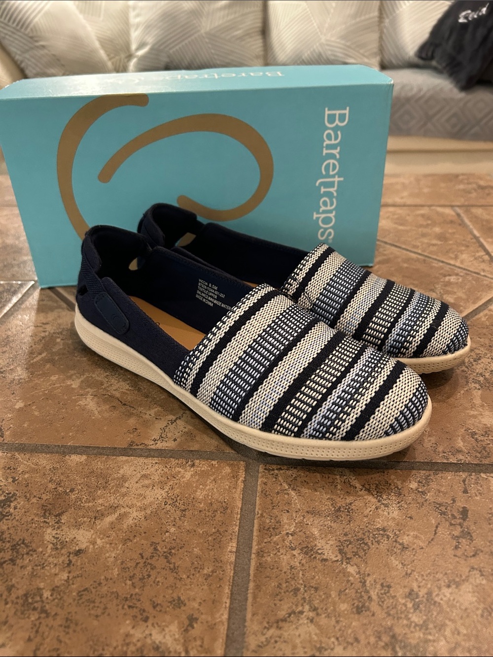Navy stripped slip on flats by Baretraps. Size 8 and a half.